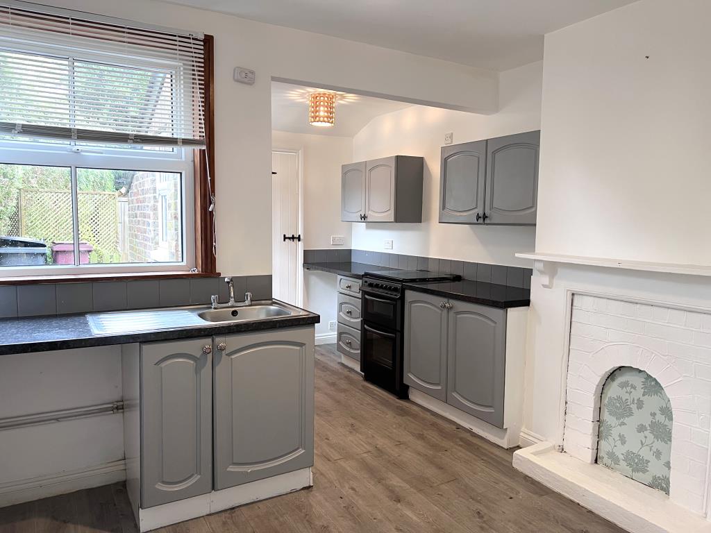 Lot: 65 - TWO-BEDROOM COTTAGE FOR INVESTMENT OR OCCUPATION - Grey painted kitchen units with wood effect laminate flooring